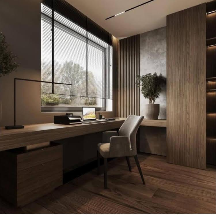 A calm studio desk by a window