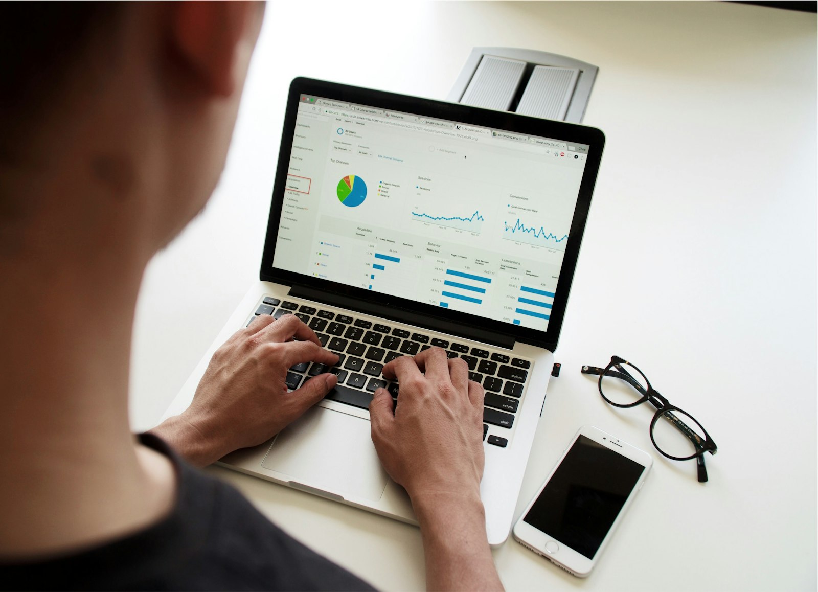 Reviewing campaign performance charts on a laptop